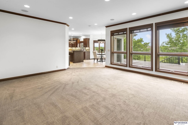 910 W Centennial Rd, Papillion, NE 68046 - unfurnished living room with crown molding, a chandelier, light colored carpet, recessed lighting, and baseboards