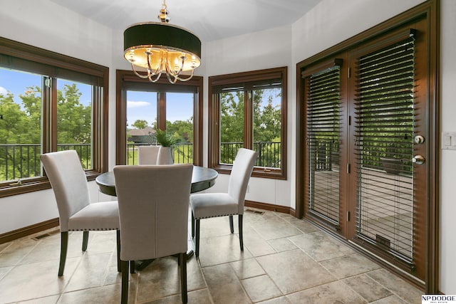 910 W Centennial Rd, Papillion, NE 68046 - dining area with a chandelier and baseboards