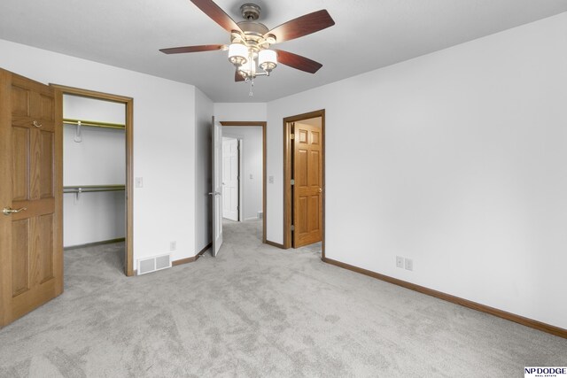 910 W Centennial Rd, Papillion, NE 68046 - unfurnished bedroom featuring baseboards, carpet floors, and a walk in closet