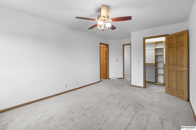 910 W Centennial Rd, Papillion, NE 68046 - unfurnished bedroom featuring baseboards, carpet flooring, a ceiling fan, and a closet