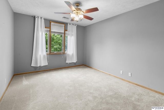 910 W Centennial Rd, Papillion, NE 68046 - spare room featuring carpet flooring, a ceiling fan, and baseboards