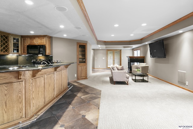 910 W Centennial Rd, Papillion, NE 68046 - kitchen featuring black microwave, recessed lighting, baseboards, glass insert cabinets, and tasteful backsplash