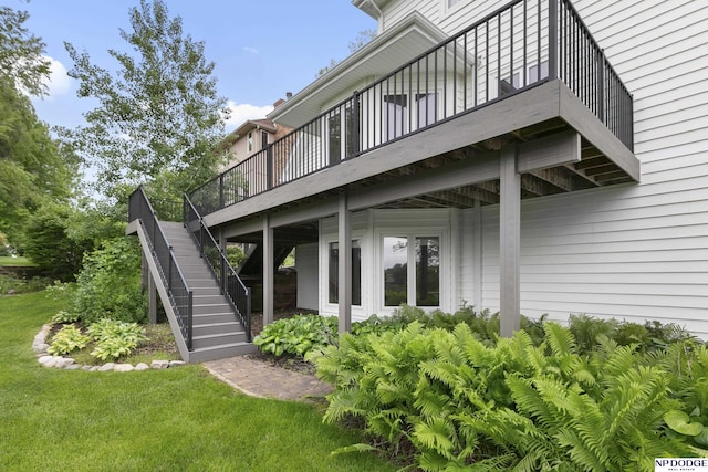 910 W Centennial Rd, Papillion, NE 68046 - view of exterior entry featuring a deck and a yard