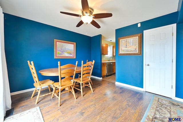 7348 N 19th St, Lincoln, NE 68521 - dining area featuring ceiling fan, baseboards, and light wood-style floors