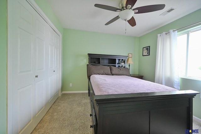 7348 N 19th St, Lincoln, NE 68521 - bedroom featuring light carpet, multiple windows, and a closet