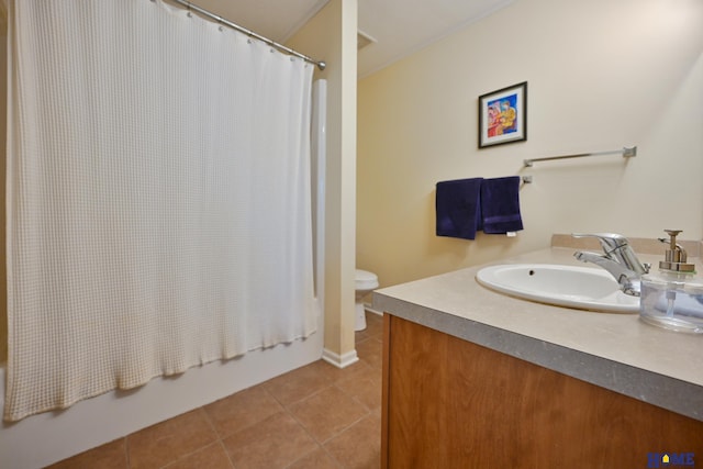 7348 N 19th St, Lincoln, NE 68521 - bathroom with vanity, tile patterned floors, toilet, and shower / bath combo with shower curtain