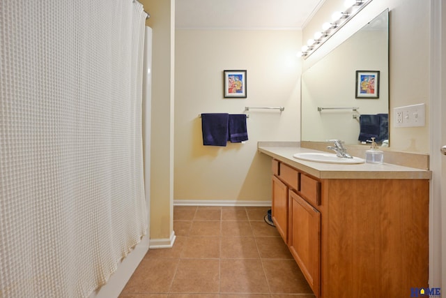 7348 N 19th St, Lincoln, NE 68521 - full bathroom featuring vanity, tile patterned flooring, baseboards, a shower with shower curtain, and crown molding