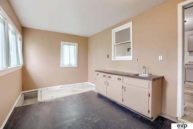 101 Station St, Shelby, IA 51570 - kitchen with a sink and white cabinets
