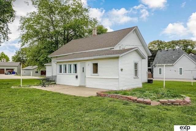 101 Station St, Shelby, IA 51570 - view of front of property with a front lawn, a patio area, and roof with shingles