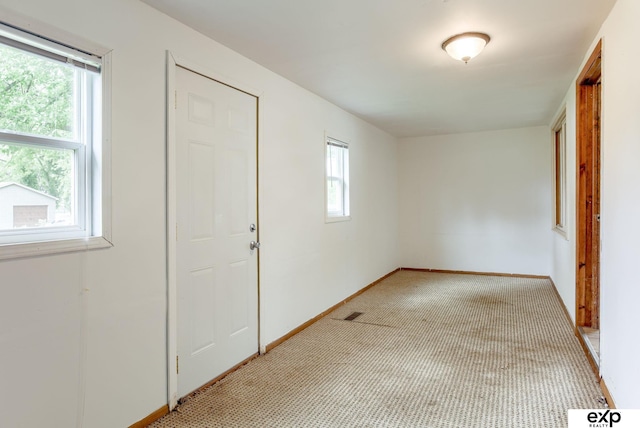 101 Station St, Shelby, IA 51570 - empty room with light carpet and baseboards
