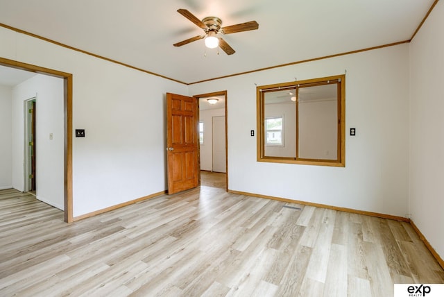 101 Station St, Shelby, IA 51570 - empty room with light wood finished floors, ceiling fan, baseboards, and crown molding
