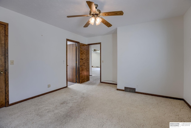 1905 S 116th St, Omaha, NE 68144 - unfurnished bedroom featuring carpet floors, baseboards, and ceiling fan