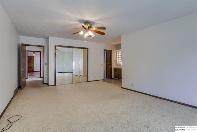 1905 S 116th St, Omaha, NE 68144 - unfurnished bedroom featuring baseboards, ensuite bathroom, and a ceiling fan