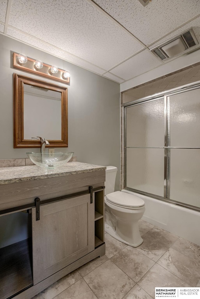 1905 S 116th St, Omaha, NE 68144 - bathroom with vanity, toilet, and shower / bath combination with glass door