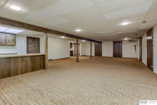 1905 S 116th St, Omaha, NE 68144 - finished basement with carpet flooring, a paneled ceiling, and wood walls