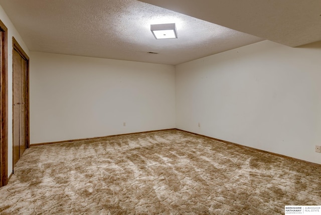 1905 S 116th St, Omaha, NE 68144 - unfurnished bedroom featuring carpet floors, a textured ceiling, and baseboards