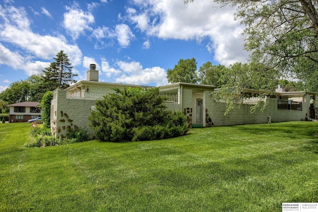 1905 S 116th St, Omaha, NE 68144 - rear view of property featuring a lawn and a chimney