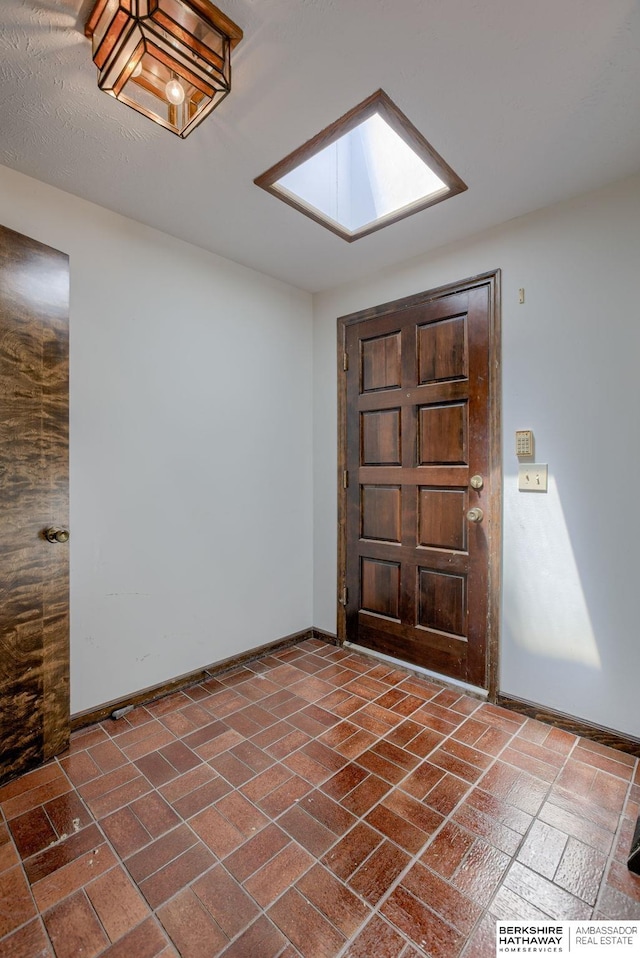 1905 S 116th St, Omaha, NE 68144 - foyer entrance featuring baseboards and a skylight