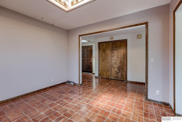 1905 S 116th St, Omaha, NE 68144 - spare room with baseboards and brick patterned flooring