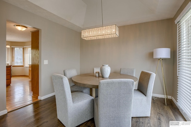 705 Ruby Rd, Papillion, NE 68133 - dining area featuring a chandelier, baseboards, and wood finished floors