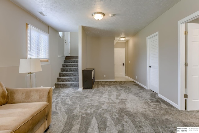705 Ruby Rd, Papillion, NE 68133 - unfurnished room with carpet, stairs, a textured ceiling, and baseboards