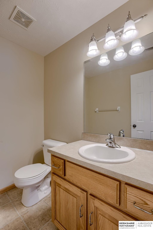 705 Ruby Rd, Papillion, NE 68133 - half bathroom with vanity, toilet, and tile patterned flooring