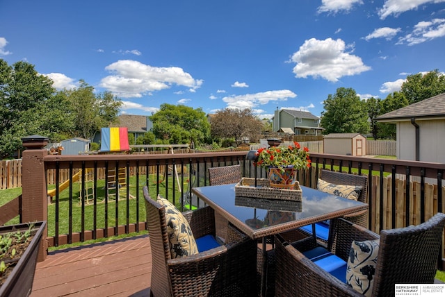 705 Ruby Rd, Papillion, NE 68133 - deck with outdoor dining area and a playground