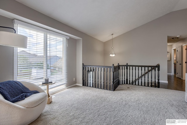 705 Ruby Rd, Papillion, NE 68133 - sitting room with an upstairs landing, carpet floors, vaulted ceiling, and baseboards