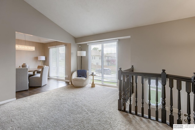 705 Ruby Rd, Papillion, NE 68133 - carpeted bedroom with a chandelier, lofted ceiling, and baseboards