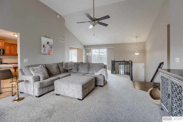 705 Ruby Rd, Papillion, NE 68133 - living area featuring light carpet, a ceiling fan, and high vaulted ceiling