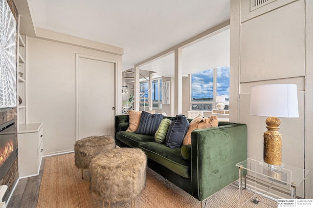 3000 Farnam St Unit 6H, Omaha, NE 68131 - living area with a fireplace and dark wood-style floors
