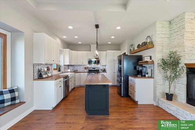 27896 Chestnut Rd, Treynor, IA 51575 - kitchen featuring stainless steel appliances, white cabinetry, a kitchen island, open shelves, and recessed lighting