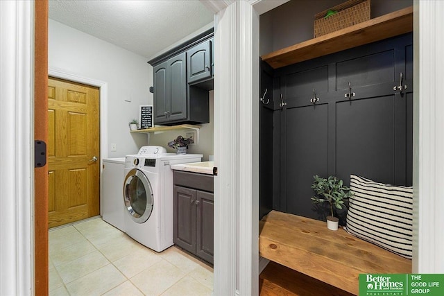 27896 Chestnut Rd, Treynor, IA 51575 - laundry room with cabinet space, washer and dryer, and light tile patterned flooring