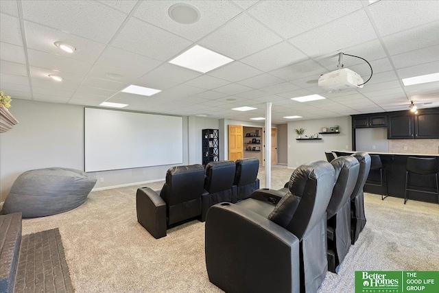 27896 Chestnut Rd, Treynor, IA 51575 - home theater room with light carpet, a dry bar, and a paneled ceiling