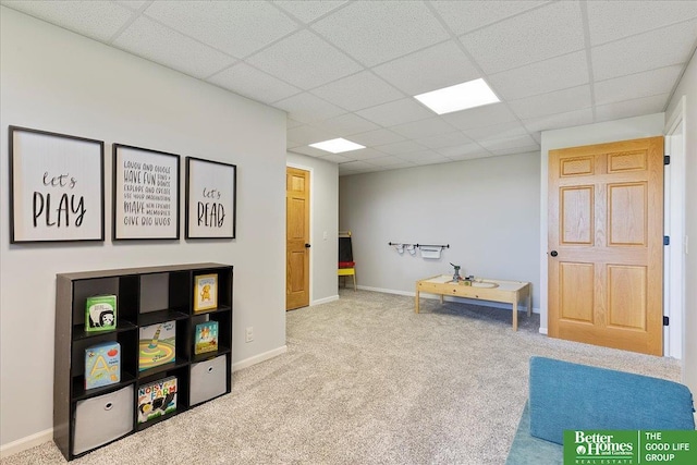 27896 Chestnut Rd, Treynor, IA 51575 - recreation room with a paneled ceiling, carpet flooring, and baseboards