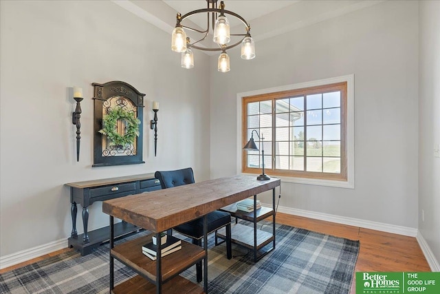 27896 Chestnut Rd, Treynor, IA 51575 - dining area with baseboards, wood finished floors, and a chandelier