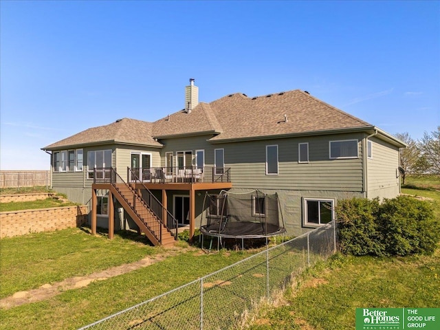 27896 Chestnut Rd, Treynor, IA 51575 - rear view of house featuring a deck, stairs, a chimney, a trampoline, and roof with shingles