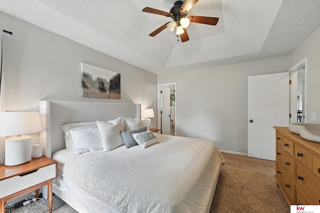 12231 Binney St, Omaha, NE 68164 - bedroom featuring a tray ceiling, light colored carpet, a ceiling fan, and baseboards