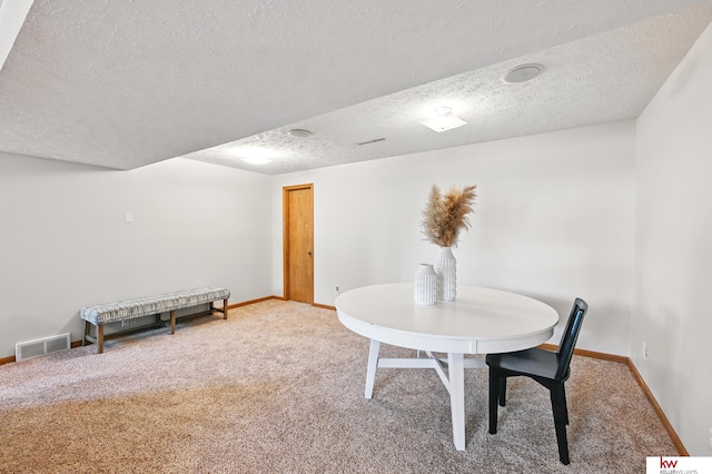 12231 Binney St, Omaha, NE 68164 - dining area with carpet, a textured ceiling, and baseboards