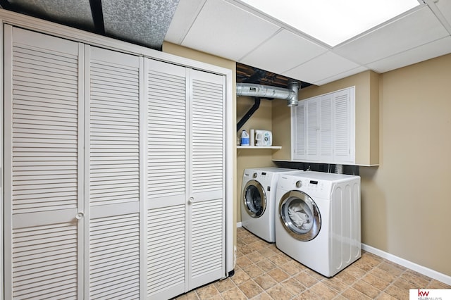 12231 Binney St, Omaha, NE 68164 - laundry room featuring washer and clothes dryer and baseboards