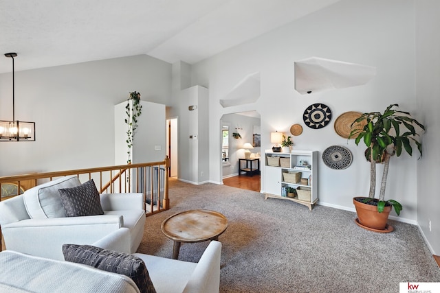 12231 Binney St, Omaha, NE 68164 - carpeted living room featuring a chandelier, baseboards, and high vaulted ceiling