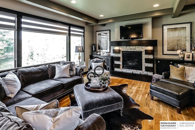 3334 S 188th Ave, Omaha, NE 68130 - living room with plenty of natural light, wood finished floors, a stone fireplace, and recessed lighting