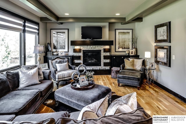 3334 S 188th Ave, Omaha, NE 68130 - living room featuring wood finished floors, a stone fireplace, recessed lighting, and baseboards