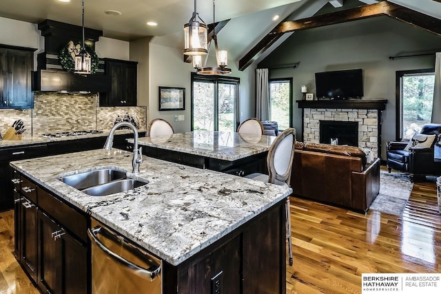 3334 S 188th Ave, Omaha, NE 68130 - kitchen featuring a sink, dishwasher, light wood-style flooring, plenty of natural light, and recessed lighting