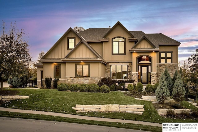 3334 S 188th Ave, Omaha, NE 68130 - craftsman inspired home featuring stone siding, a lawn, stucco siding, and a shingled roof