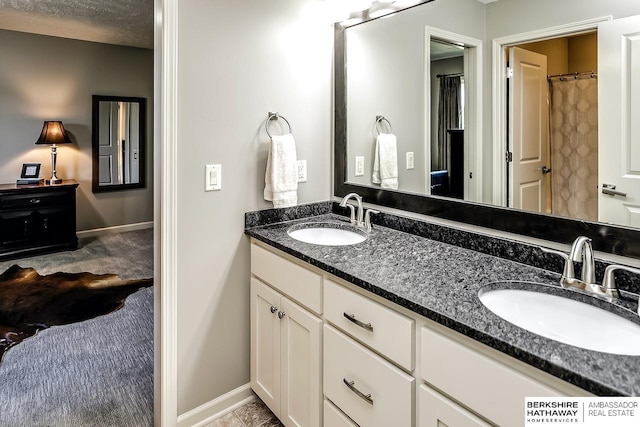 3334 S 188th Ave, Omaha, NE 68130 - bathroom with double vanity and baseboards