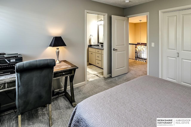 3334 S 188th Ave, Omaha, NE 68130 - bedroom with light colored carpet, a sink, baseboards, and ensuite bath