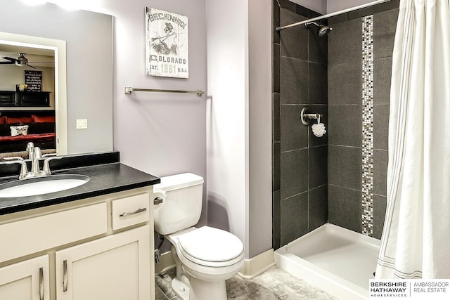 3334 S 188th Ave, Omaha, NE 68130 - bathroom with ceiling fan, toilet, vanity, and a tile shower