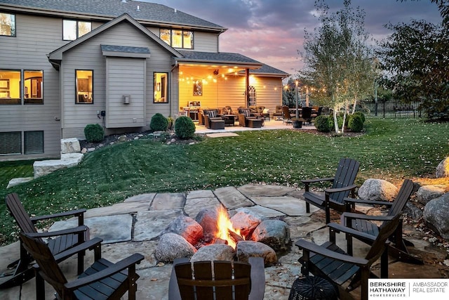3334 S 188th Ave, Omaha, NE 68130 - rear view of house featuring an outdoor living space with a fire pit, a patio, and a shingled roof