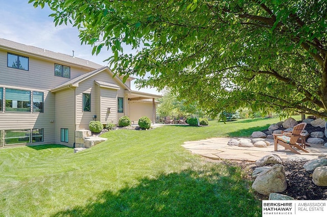3334 S 188th Ave, Omaha, NE 68130 - view of green lawn with a patio area